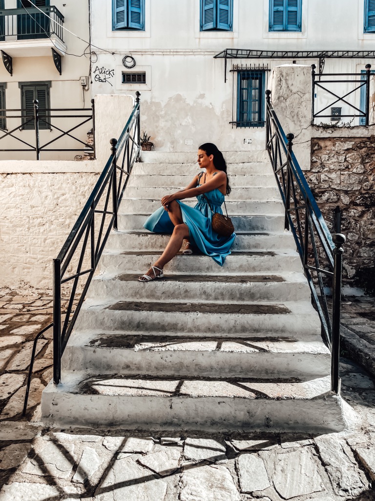 The author, sitting on a staircase in Athens